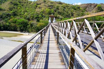 Fototapeta premium Santa Fé de Antioquia, Antioquia, Colombia; January 4, 2024: Western bridge (Puente de Occidente).