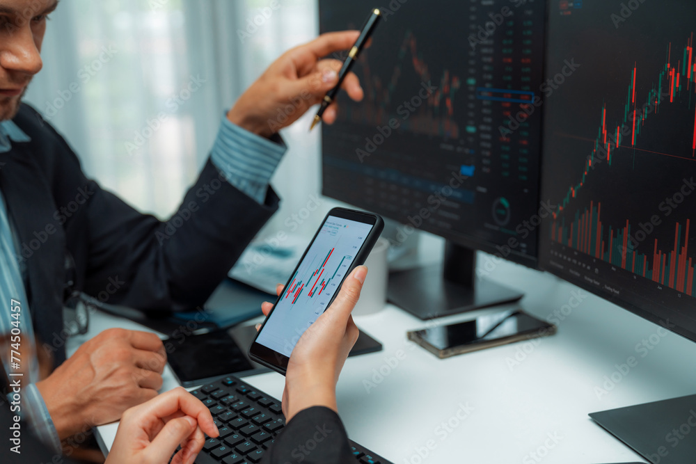 Poster focusing on phone with discussing dynamic stock market in two business traders online website compar