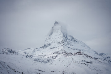 This image captures the Matterhorn's serene grandeur in the Swiss Alps by Zermatt, showing its...