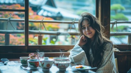 Serene Young Woman Enjoying Traditional Tea Time by Window Overlooking Autumn Scenery