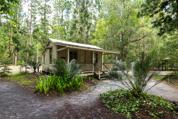 Log cabins at Central Station camping area on the sand island of K’gari (Fraser Island), Queensland, Australia