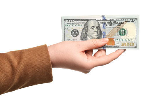 Money exchange. Woman holding dollar banknotes on white background, closeup
