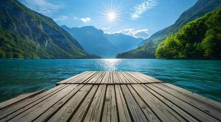 Wooden pier over the clean blue lake in mountain forest on sunny summer day