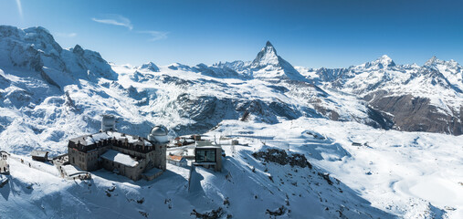An aerial view of Zermatt ski resort in the Swiss Alps shows the Matterhorn, snow covered slopes,...
