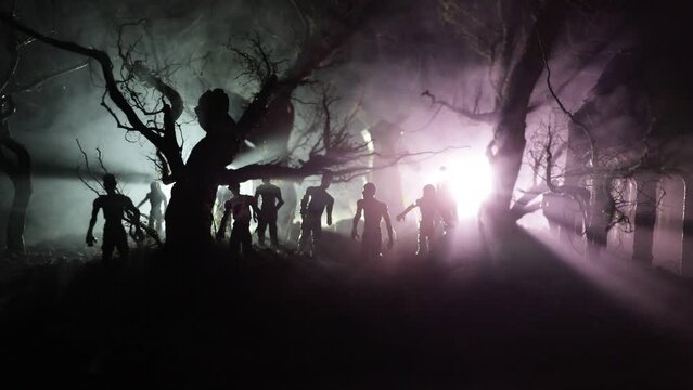 Silhouette of person standing in the dark forest with light. Horror halloween concept. strange silhouette in a dark spooky village