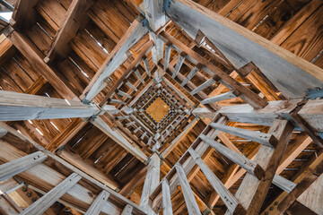 looking up a wooden tower - obrazy, fototapety, plakaty