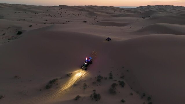 Offroading through the desert at dusk