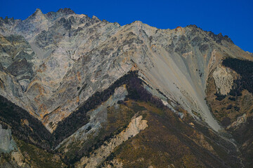 Rocky mountain with different minerals and a triangular shape in Argentine Patagonia.