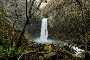 Niigata, Japan - November 7 2023 : Majestic Naena waterfall with beautiful settings in autumn at Joetsu, Japan.