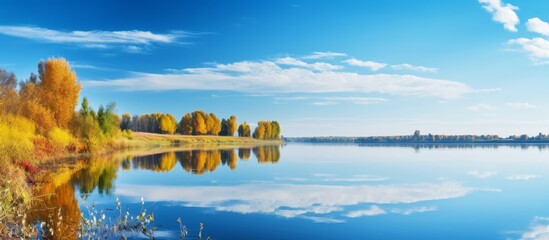 Tranquil view of a beautiful lake nestled among lush trees with a clear blue sky in the background - Powered by Adobe