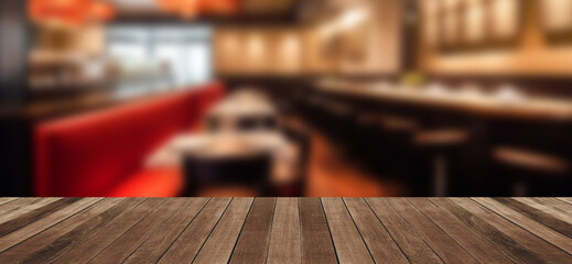Empty wood tabletop or counter with display product. Blur image of restaurant interior background.