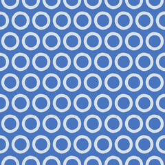 Circles seamless pattern. Modern stylish abstract texture. Repeating hand-drawn rings, brush style, blue