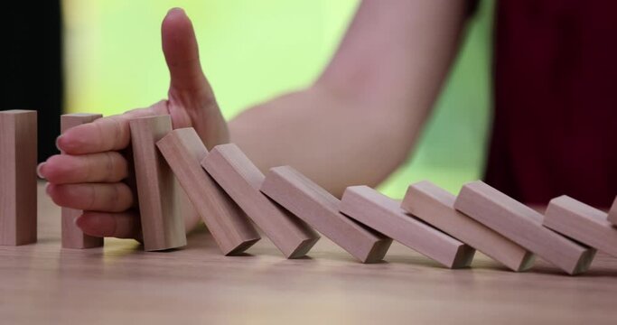 Domino effect and stopping the chain reaction with hand