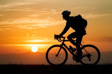 Fototapeta na wymiar Cyclist against sunset, sport and travel concept, outdoor activity