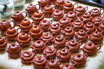 Close-up of exquisite and elegant Chinese purple sand ceramic tea cups and teapots