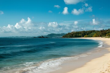 Obraz premium Idyllic beach panorama with clear blue sky and calm waves