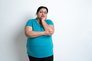 Overweight fat indian woman feeling sad isolated over white background. Plus size female....
