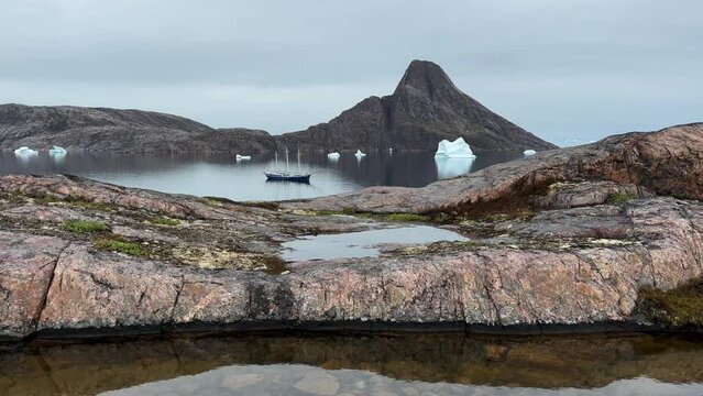 Three-masted schooner in the fjord at Bear Islands in Scoresbysund, Greenland.