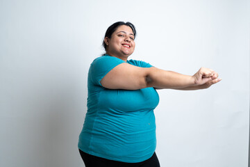 Overweight fat indian woman doing exercise for weight loss. isolated over white background. Plus size female. Healthcare Concept. Copy Space