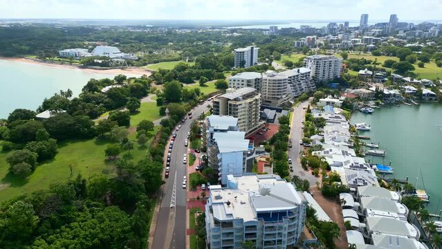 Aerial Drone of Cullen Bay and Marina With Cars Driving Along Road in Darwin NT Australia