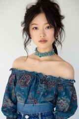 Close-up of a Chinese Super Model in Boho-Chic Off-the-Shoulder Blouse and Denim Skirt, radiating carefree charm with a whimsical expression photo on white isolated background