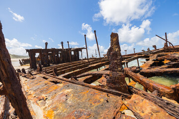 Fototapeta na wymiar Wide view of the S.S. Maheno Shipwreck along 75 mile beach on the sand island of K’gari, Queensland, Australia