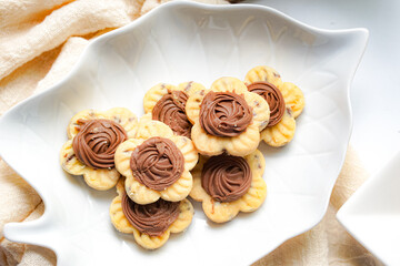 Popular cookies in Malaysia and Singapore during celebration of Eid Mubarak (Hari Raya) on white background. Selective focus and blurry.