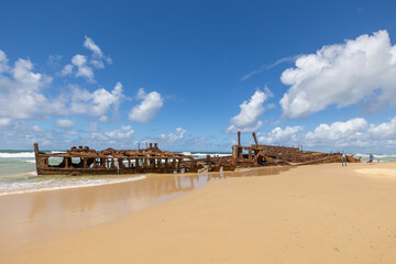 Wide view of the S.S. Maheno Shipwreck along 75 mile beach on the sand island of K’gari, Queensland, Australia