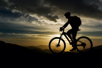 Obraz premium Silhouetted figure with mountain bike against dramatic sunset backdrop