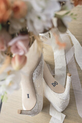 Elegant bridal heels adorned with “I DO” inscription, capturing wedding romance
