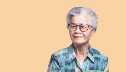Elderly Asian woman with glasses looking at the camera.