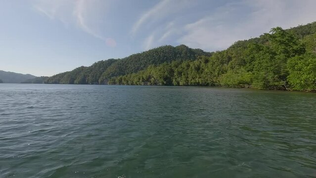 Exploring The Amazing Blue River Kali Biru In Raja Ampat, West Papua, Indonesia. POV Shot