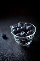 Bilberries on dark background. Close up.