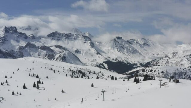 Arabba ski resort winter sports fun, Dolomite mountains scenic landscape Drone shot
