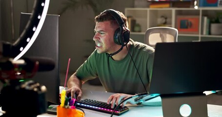Gaming, frustrated and angry man with pc for live streaming on social media, mobile app and website. Influencer, content creator and person with ring light for tutorial, broadcast and video games