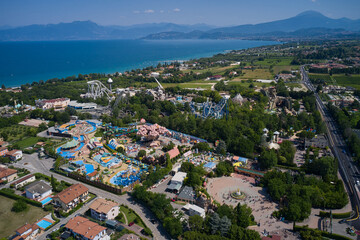 Aerial panorama of the popular amusement park on Lake Garda. Sights of Italy. Amusement park, attractions on Lake Garda in Italy, aerial view.