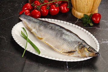 Whole raw salted herring fish