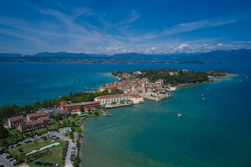 Sirmione, Lake Garda, Italy. Aerial view of the center of Sirmione Castle. In the background blue sky, sunny day, good weather