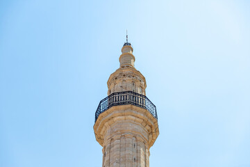Fototapeta na wymiar Neratze Mosque iconic Minaret at Rethymno city, Crete island, Greece. Under view of Islamic monument