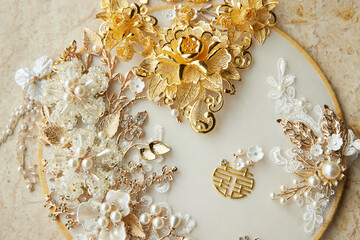 A luxurious collection of intricate golden and pearl jewelry pieces.