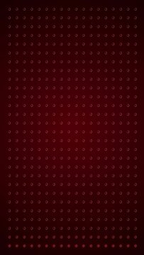 Vertical video animation of an abstract glowing red LED wall with bright light bulbs - abstract background.