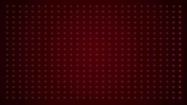 Video animation of an abstract glowing red LED wall with bright light bulbs - abstract background.