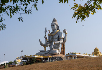 the majestic Shiva statue in Murudeshwar,Karnataka. This iconic statue is one of the tallest statues of Lord Shiva in the world and is a popular tourist destination known for its spiritual significant