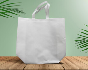 White Color Eco Friendly Tote Bag With Loop Strap. Non Woven Fabric Bag isolated on wood table with...