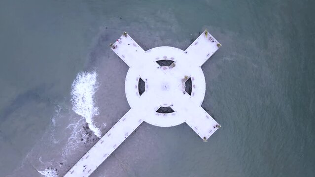 Tourist boardwalk in shape of cross over the sea. San Blas, Nayarit, Mexico. Aerial