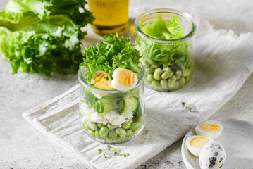 green salad in a jar with edamame beans