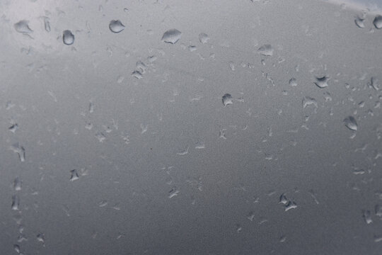 Water droplets on the surface of the car.