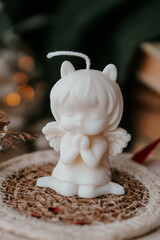 Cute small soy wax candles on a wooden tray