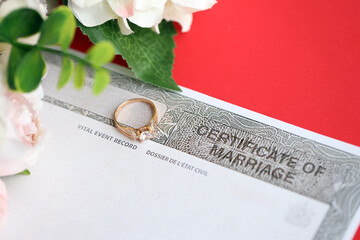 Obraz premium Canadian Certificate of registration of marriage blank document and wedding ring close up
