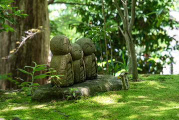 Ryo-en Jizo is a group of three little Buddha statues within the Hase-dera Temple, Kanto, Kamakura,...